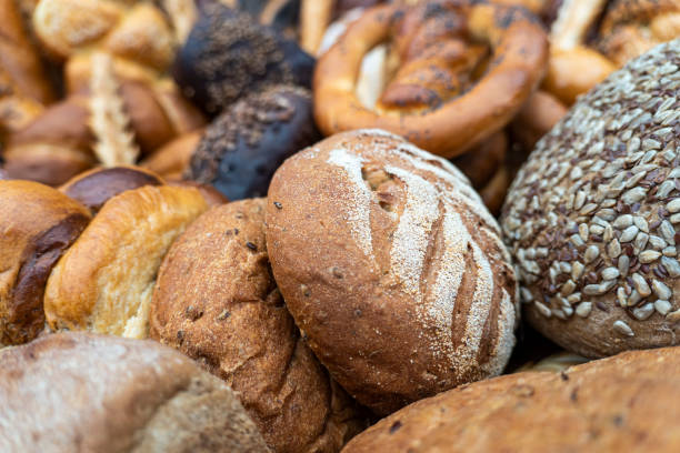 istock Different kinds of fresh bread background, bakery food concept 1411008975