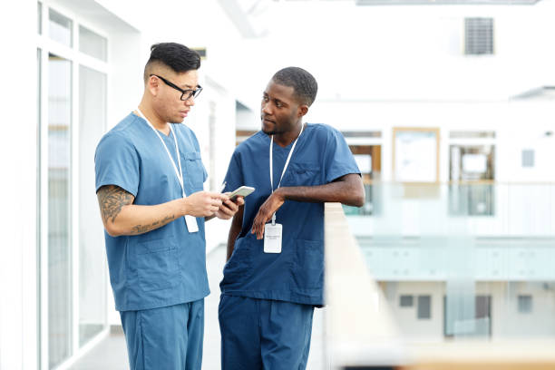 istock Two Male Medics in Hall 1411009998