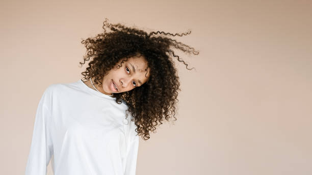 istock Woman dances and shakes her head 1411010257