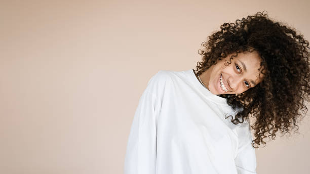 istock Woman dances and shakes her head 1411010284