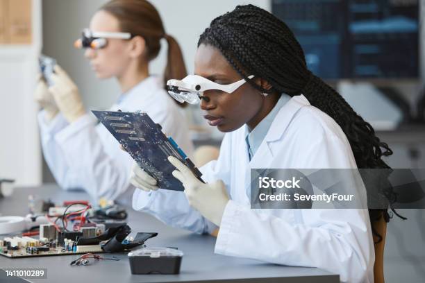 Engineers Working With Tech Stock Photo - Download Image Now - STEM - Topic, Women, Engineer