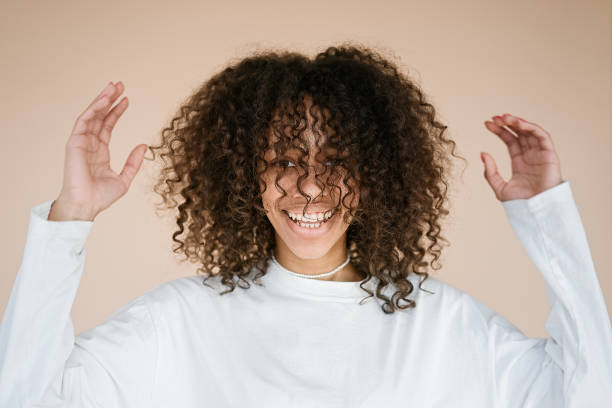 istock Woman dances and shakes her head 1411010319