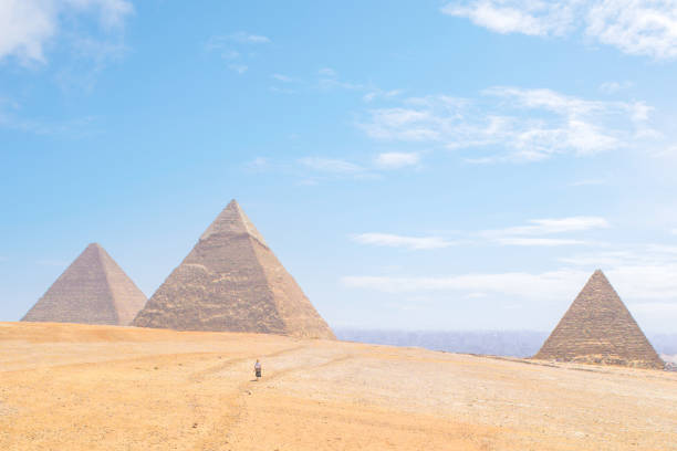The aerial panorama view of Egyptian pyramids of Giza, with Giza town and Cairo city districts is seen in the background.