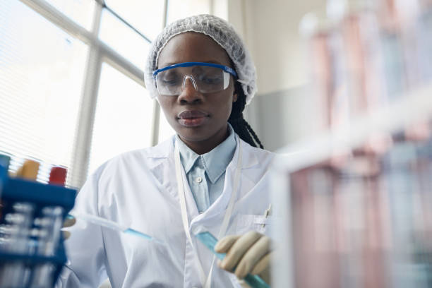 istock Black Young Woman Working in Laboratory 1411010833