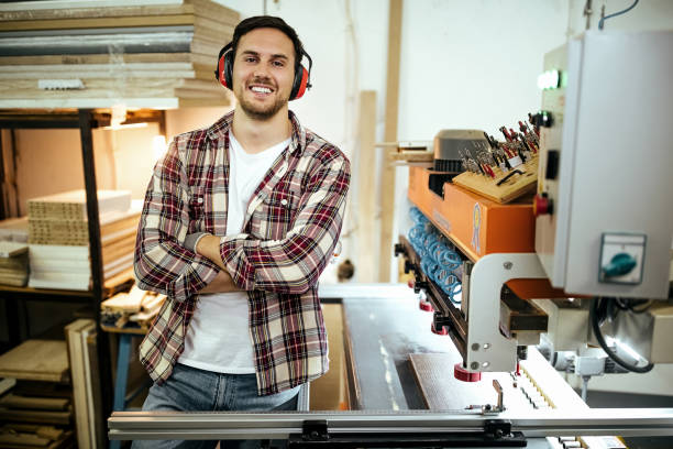istock Portrait of professional carpenter wearing protective gear 1411010899