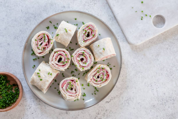 istock Ham and cream cheese rolled up in a tortilla 1411011093