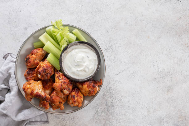 istock buffalo chicken wings with celery and beer 1411011383
