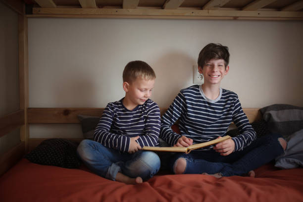 istock The brothers read together on two bunk beds 1411011510
