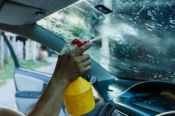 istock Car Films Installing windshield protection film blur.; 1411011727