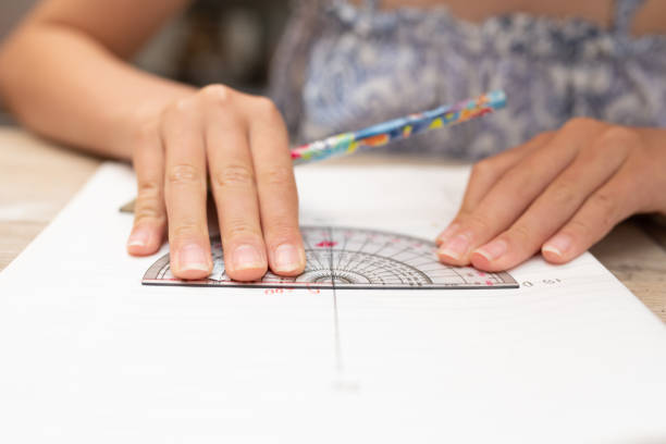 istock Hands of a child studying at home 1411013924