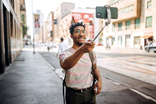 istock Hipster man travel vlogging from the city 1411014980