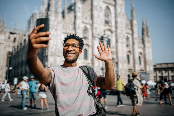 istock Tourist taking a selfie on the city square 1411015124