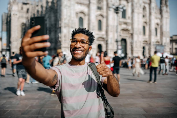 istock Tourist taking a selfie on the city square 1411015147