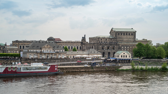 Dresden, Germany - May 10, 2022: Panorama on the banks of the Elbe during the day with a view of the Semperoper and the Dresden Zwinger during the day.