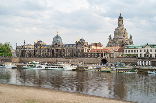 Dresden, Germany - May 10, 2022: The banks of the Elbe in Dresden with a view of the Frauenkirche and Brühl's Terrace with the art gallery in the Lipsius building during the day.