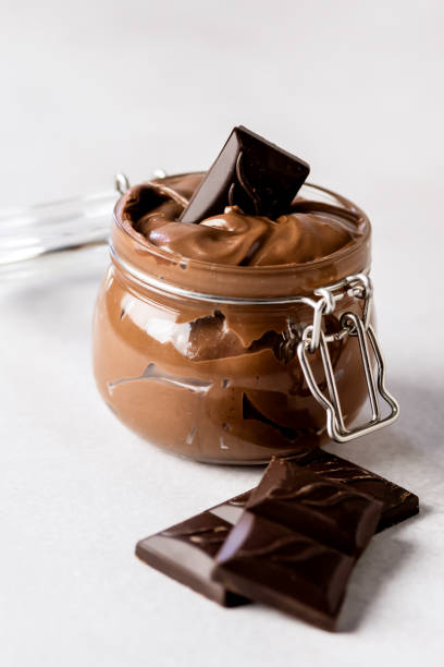 istock Background with Tasty Homemade Chocolate Spread or Butter Vertical 1411015843