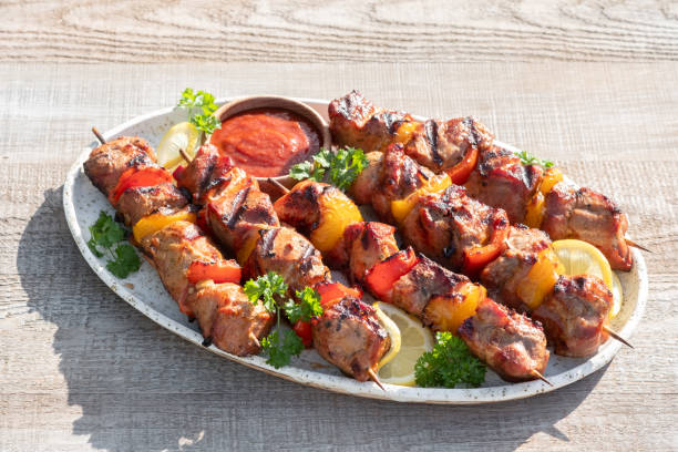 istock Grilled pork kebab with red and yellow pepper 1411016356