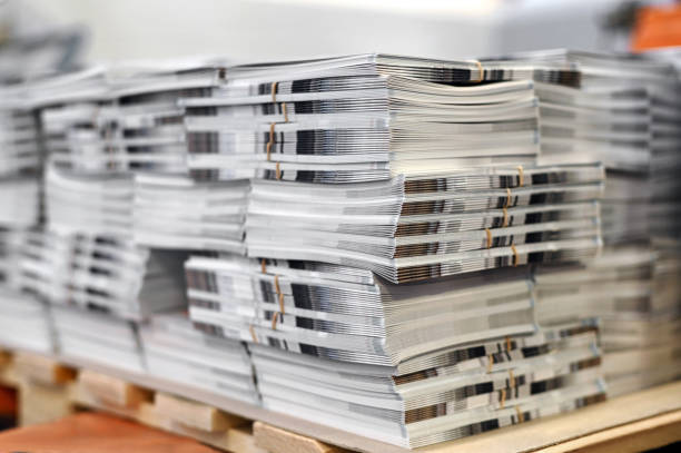Stack of freshly printed catalogs stock photo