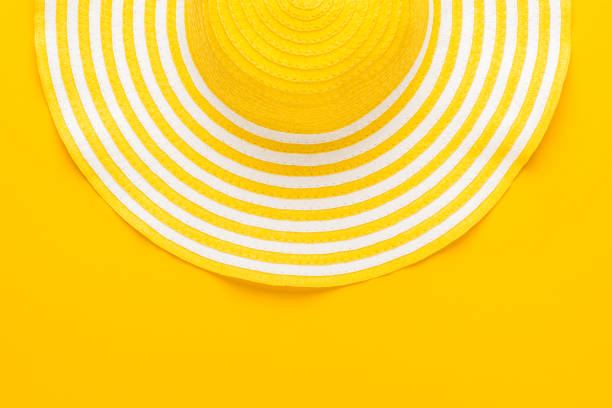 top view of yellow striped retro hat close-up with copy space