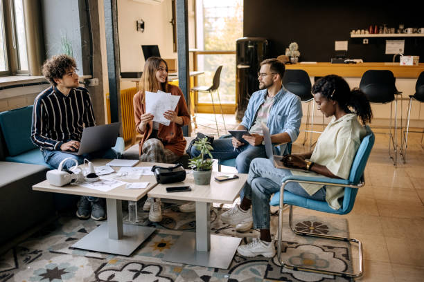 istock Colleagues working together in the office 1411018758