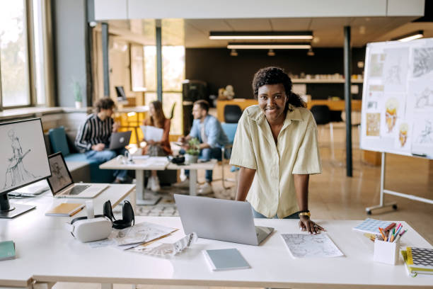 istock Young female game designer posing in the office setup 1411018787