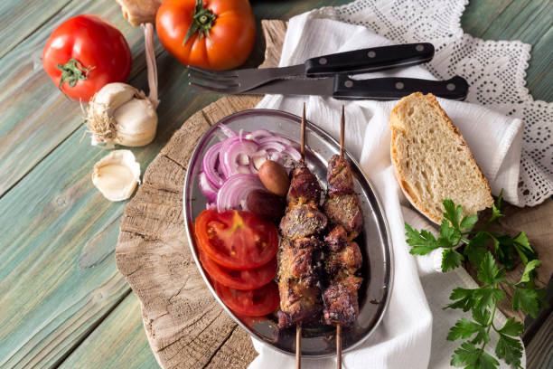 istock The shashlik on a wooden table 1411019822