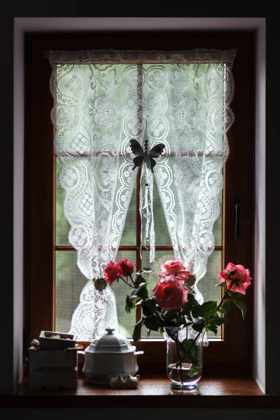istock A vase with flowers is on the windowsill. 1411019844