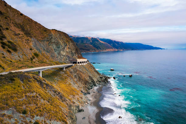 Pitkins Curve Bridge and Rain Rocks Rock Shed along Pacific Coast Highway and Big Sur coastline in California, USA.