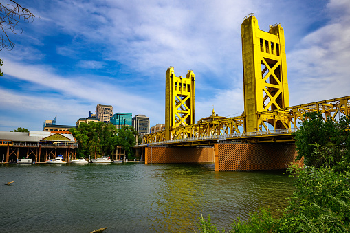 Gold Tower Bridge and Sacramento River in Sacramento, California, photographed from River Walk Park.