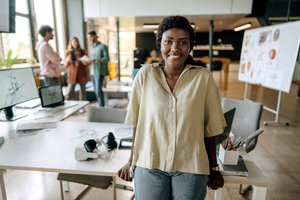 istock Young female game designer posing in the office setup 1411020236