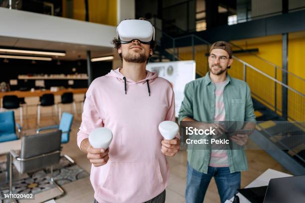Colleagues Testing Out Virtual Reality Software Stock Photo - Download Image Now - Gamification, Video Game, Virtual Reality