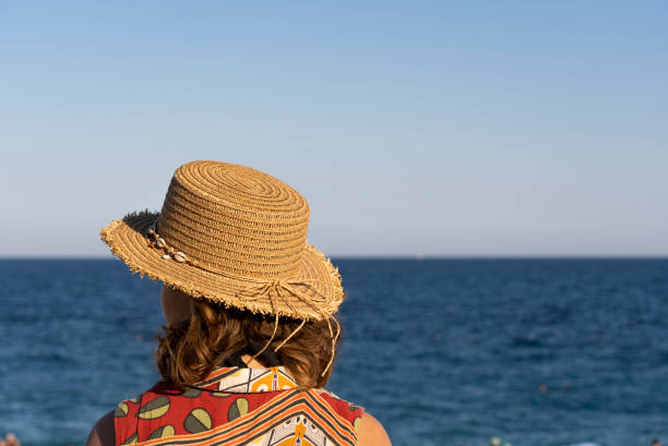 A person thinking in front of a sea view in a beach park