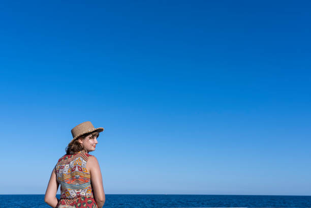 A person thinking in front of a sea view in a beach park