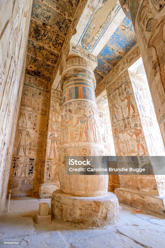 The Temple of Ramesses III, Luxor, Egypt The Temple of Ramesses III, Luxor, Egypt - July 26, 2022:  The Temple of Ramesses III at Medinet Habu was an important New Kingdom period temple structure in the West Bank of Luxor in Egypt. Aside from its size and architectural and artistic importance, the mortuary temple is probably best known as the source of inscribed reliefs depicting the advent and defeat of the Sea Peoples during the reign of Ramesses III. Coptic Stock Photo