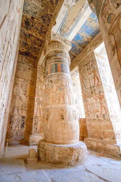 The Temple of Ramesses III, Luxor, Egypt - July 26, 2022:  The Temple of Ramesses III at Medinet Habu was an important New Kingdom period temple structure in the West Bank of Luxor in Egypt. Aside from its size and architectural and artistic importance, the mortuary temple is probably best known as the source of inscribed reliefs depicting the advent and defeat of the Sea Peoples during the reign of Ramesses III.