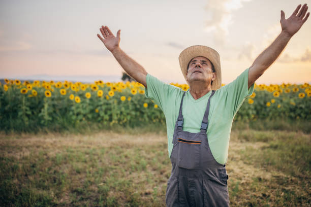 istock The farmer is praying for rain, looking at the sky 1411020787