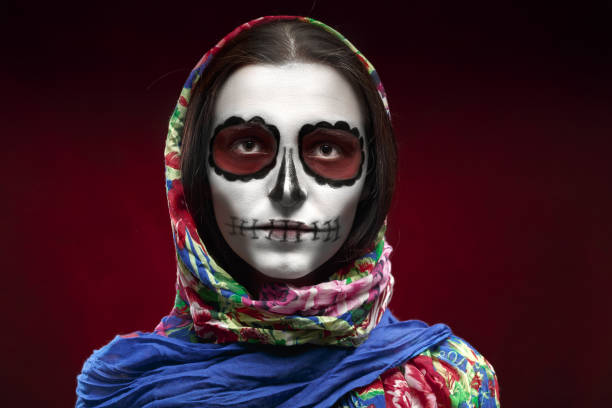 santa muerte makeup young woman with santa muerte makeup on red background muerte stock pictures, royalty-free photos & images