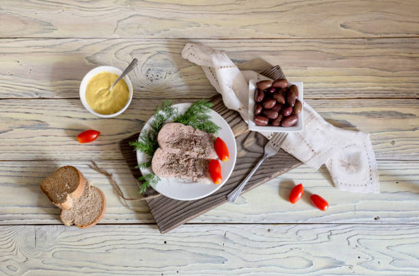 istock Sliced veal tongue on a white plate 1411024378