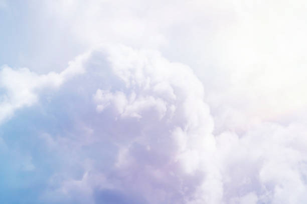 istock Background with closeup of white cumulus cloud. Soft heavenly light bringing blessing. 1411024504