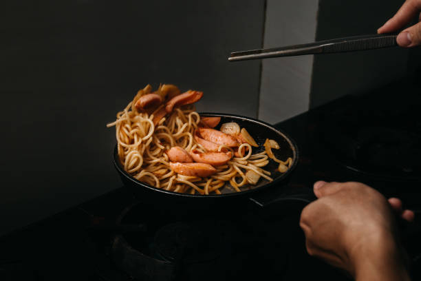 Chef Hands Cooking Sausage Spaghetti