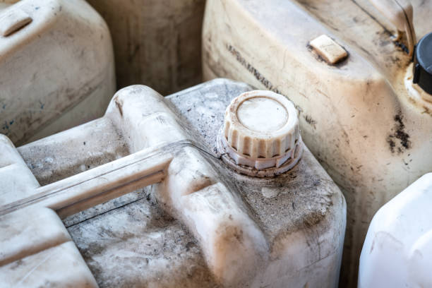 A chemical gallon - Industrial equipment object. A chemical or fuel oil gallon which is stored at the factory warehouse area. Industrial equipment object, close-up and selective focus at the bottle's cap. drum container stock pictures, royalty-free photos & images