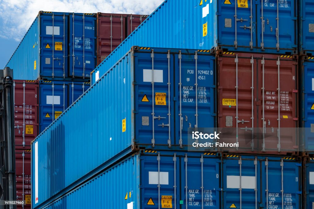 Close-up blue and red logistic container. Cargo and shipping business. Container ship for import and export logistics. Logistic industry. Container for truck transport. Freight transportation concept. Cargo Container Stock Photo