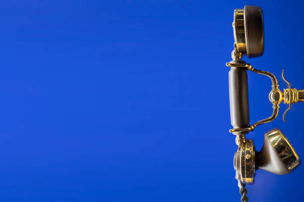 gold old phone on the blue backgrounds