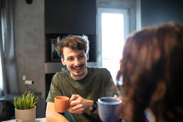 istock Young couple talking during morning coffee time 1411027752
