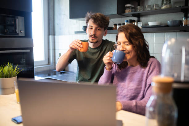 istock Young couple talking during morning coffee time 1411027808