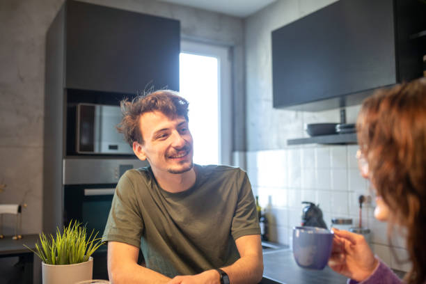 istock Young couple talking during morning coffee time 1411028403