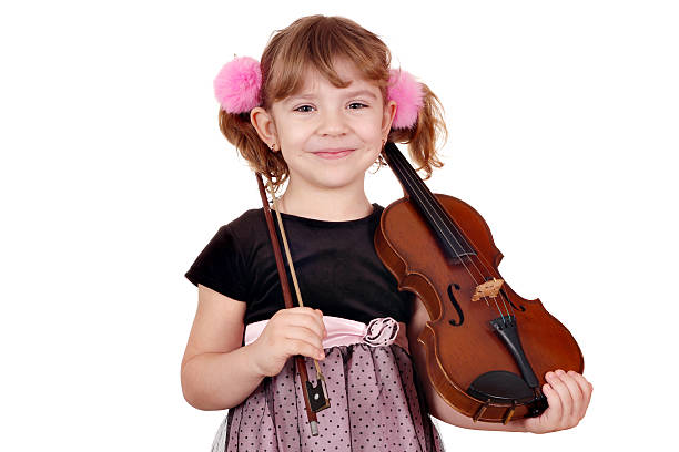 istock little girl posing with violin 141102900