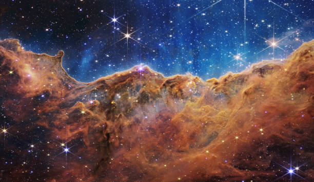 James Webb Space Telescope reveals emerging stellar nurseries and individual stars in the Carina Nebula James Webb Space Telescope reveals emerging stellar nurseries and individual stars in the Carina Nebula nebula stock pictures, royalty-free photos & images