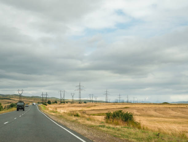 istock High Voltage power lines in a rural landscape 1411033321