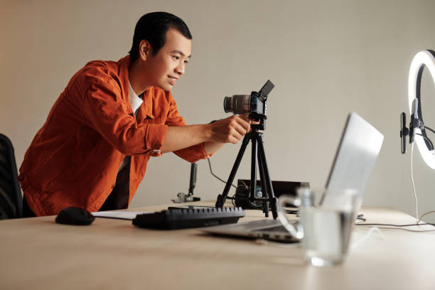 istock Blogger Setting Camera to Film Review 1411034389